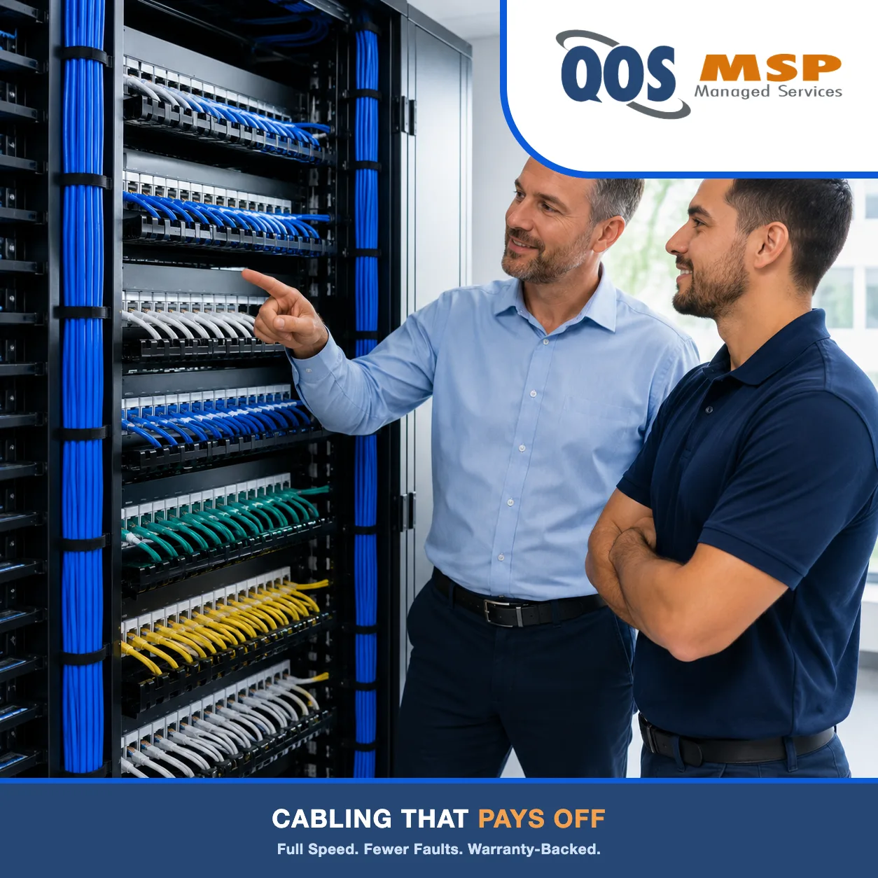 IT manager and technician reviewing a finished, labeled patch panel in a tidy cabling closet — benefits of professionally installed cabling.