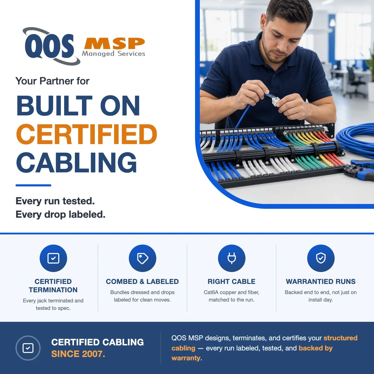 Technician terminating a Cat6A cable onto a keystone with a combed patch panel — professional copper cabling installation by QOS MSP.