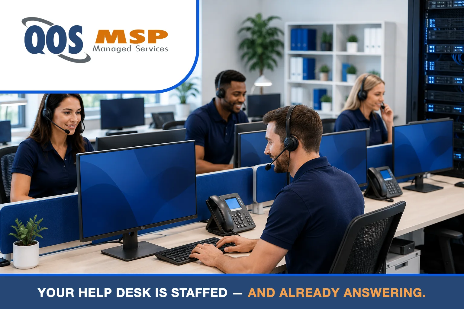 Team of help desk support professionals in navy polo shirts taking calls at a shared desk pod