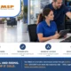 Dealership ransomware protection — dealer group staff working calmly at a secured back-office workstation beside a network cabinet, with the showroom glass glowing warm behind them